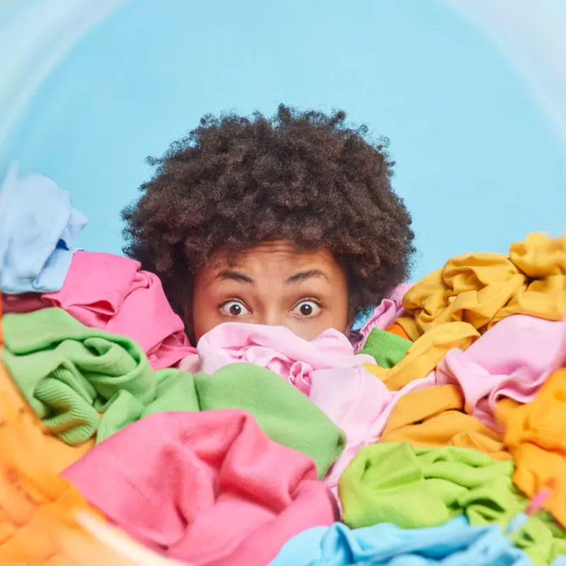 Stack of professionally folded laundry from the wash and fold service.